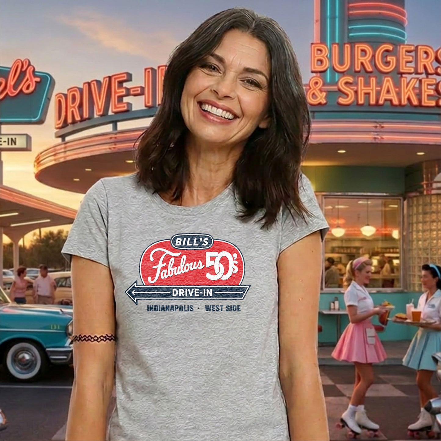 Woman wearing a Bill's Fabulous 50's Drive-In Indianapolis nostalgia t-shirt in front of a retro drive-in restaurant scene.