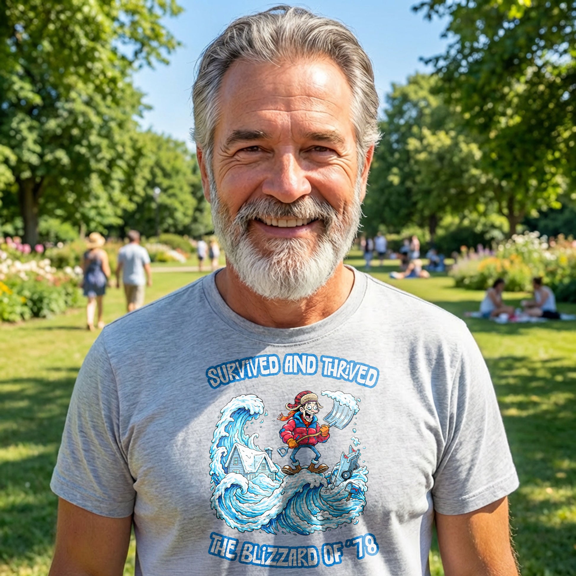 Smiling man wearing Blizzard of 78 t-shirt outdoors in park on sunny day