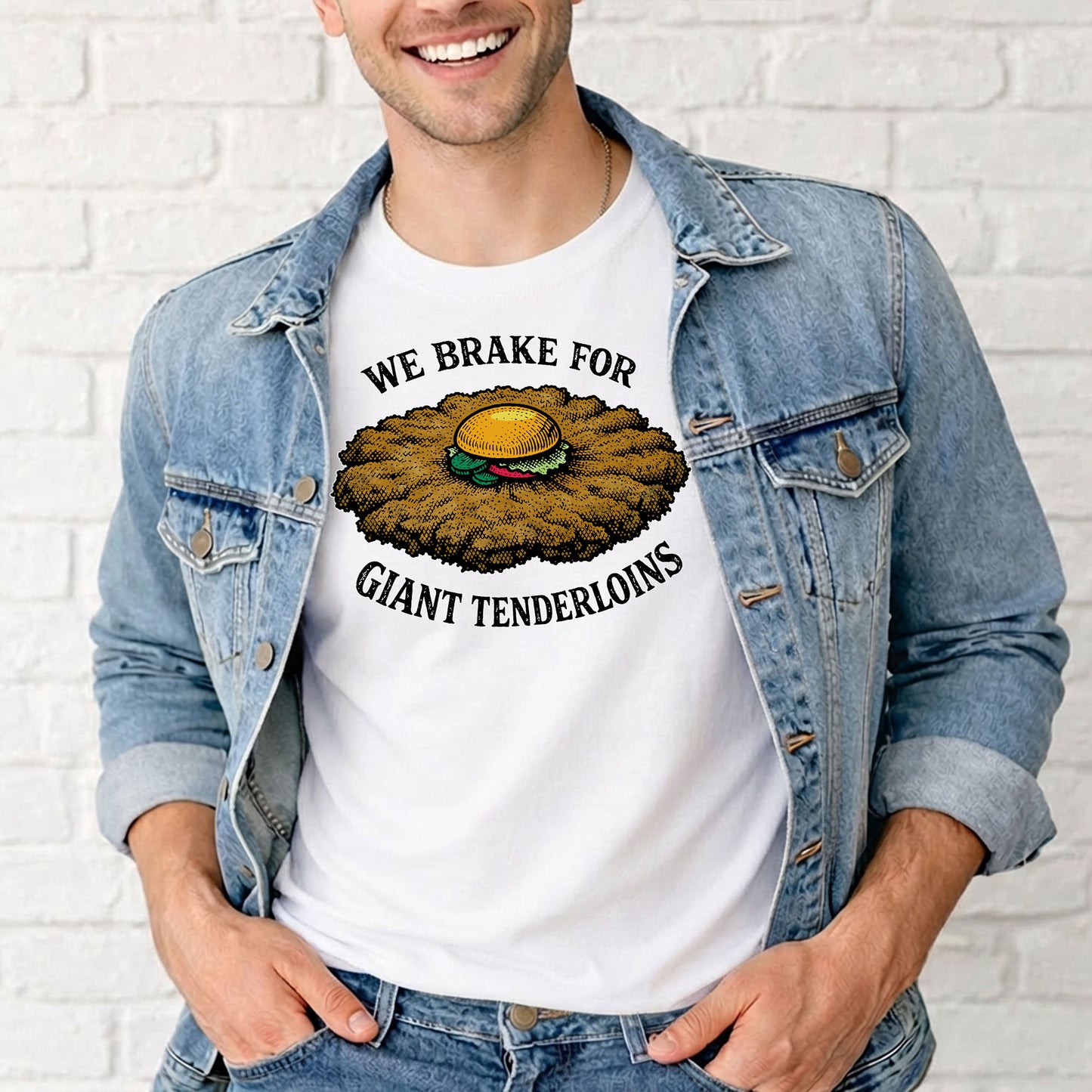 Man wearing white Indiana tenderloin t shirt with giant sandwich graphic in outdoor setting
