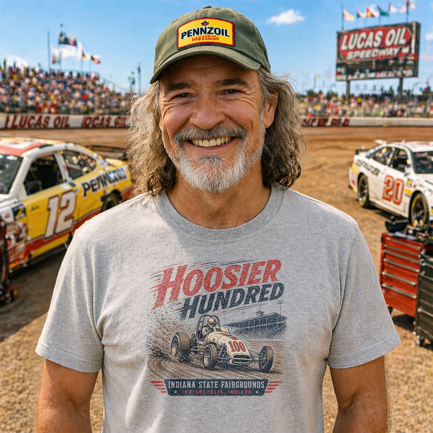 Man wearing a vintage Hoosier Hundred Indiana State Fairgrounds dirt-track racing t-shirt featuring a classic open-wheel race car illustration.