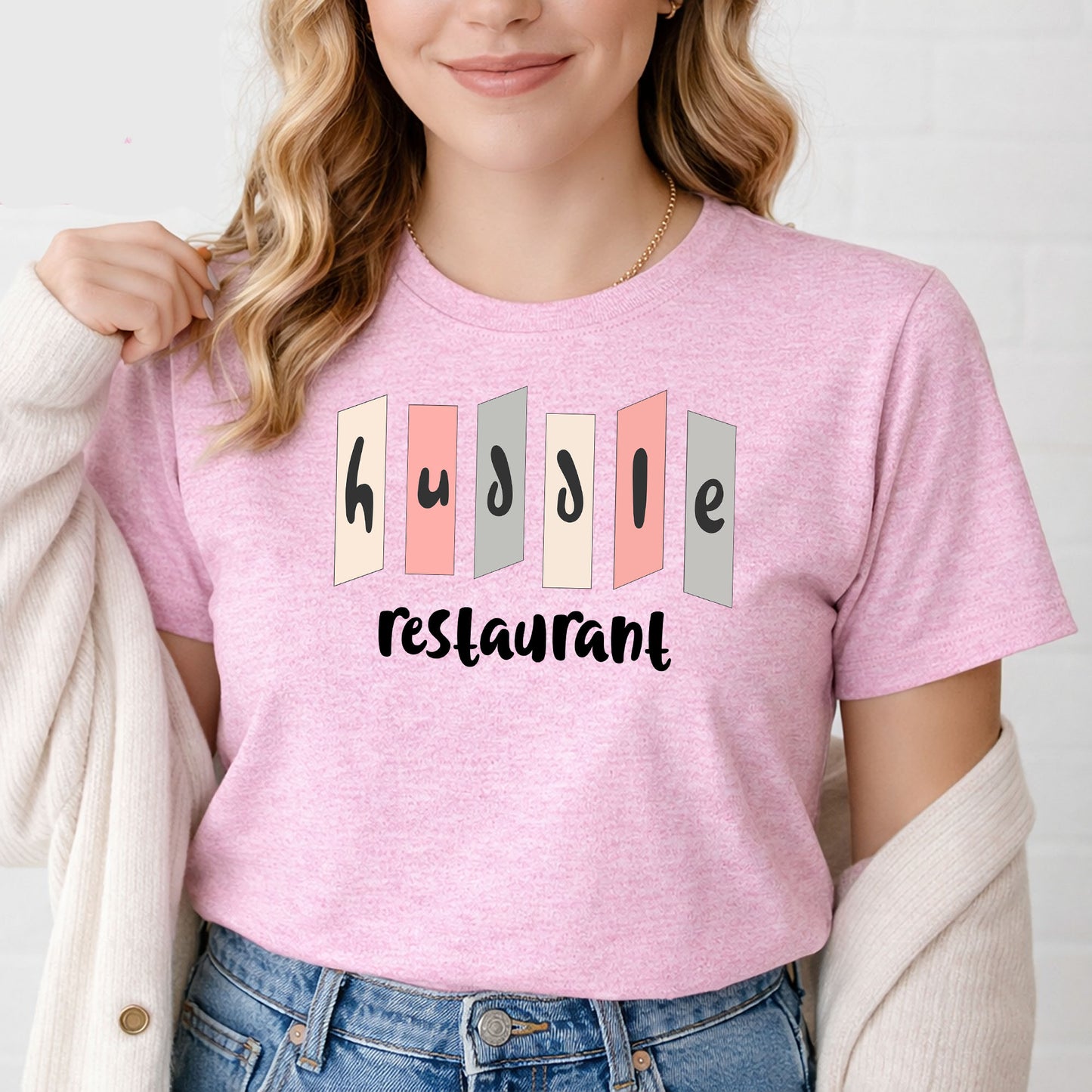 Woman wearing retro Huddle Restaurant Indianapolis nostalgia t-shirt with vintage diner sign artwork