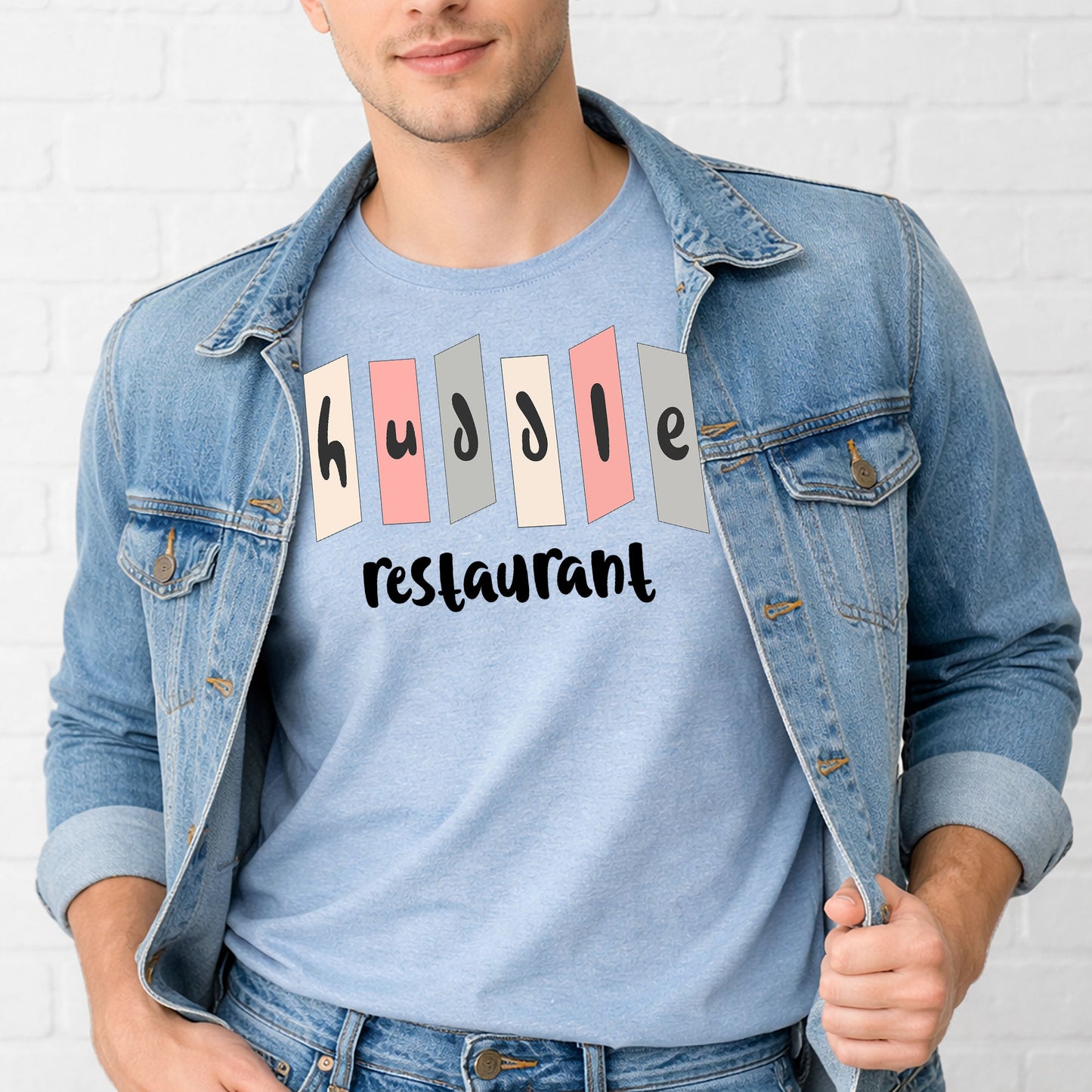 Man wearing retro Huddle Restaurant Indianapolis nostalgia t-shirt with mid-century roadside sign design