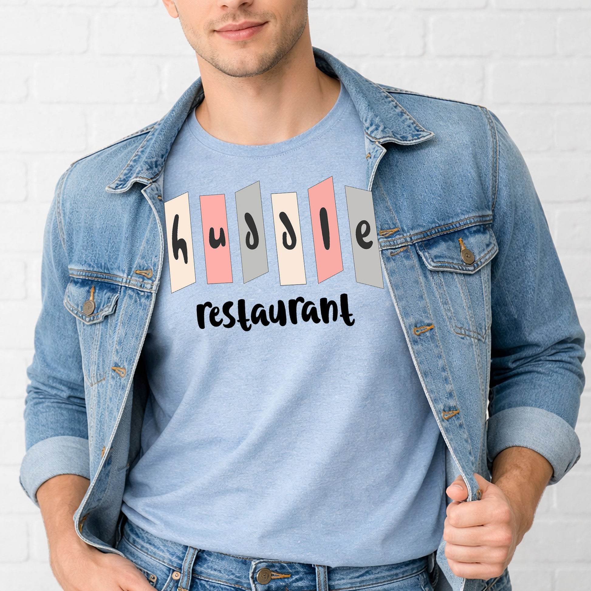 Man wearing retro Huddle Restaurant Indianapolis nostalgia t-shirt with mid-century roadside sign design