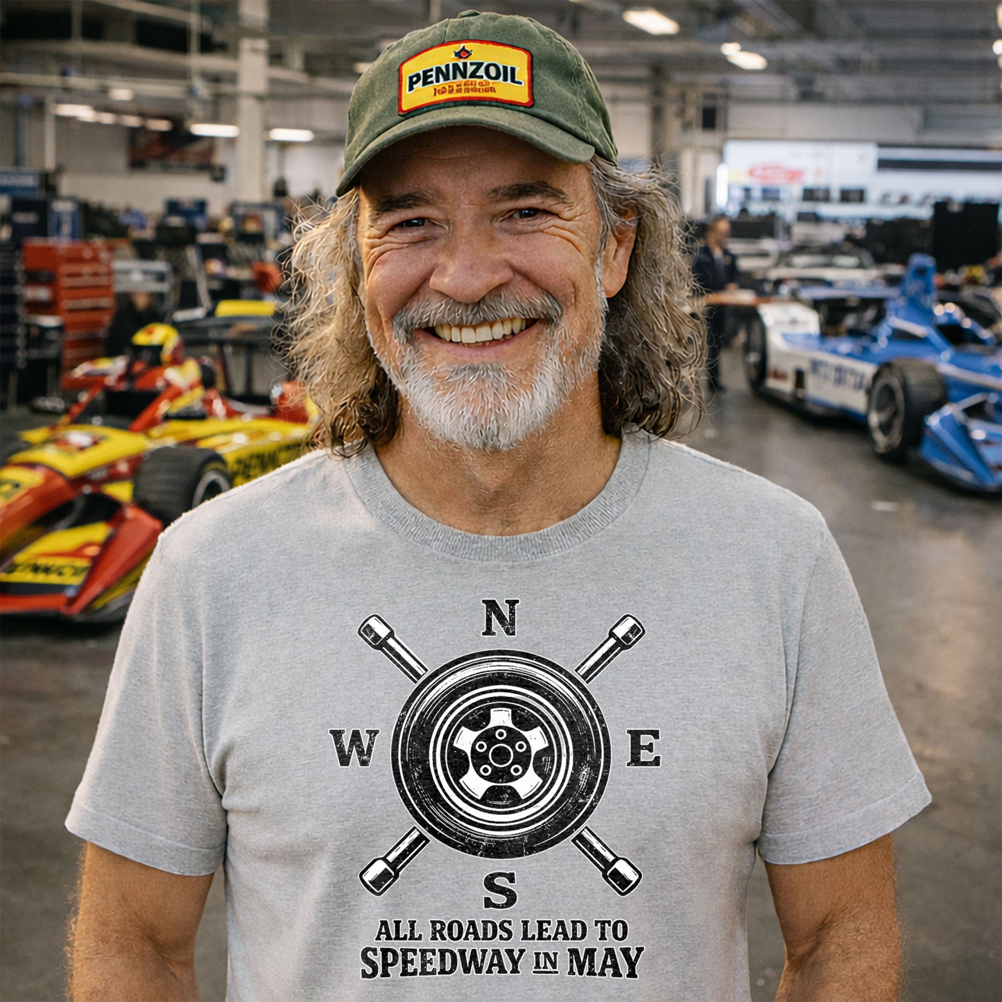 man wearing all roads lead to speedway t shirt in garage indy racing fan apparel