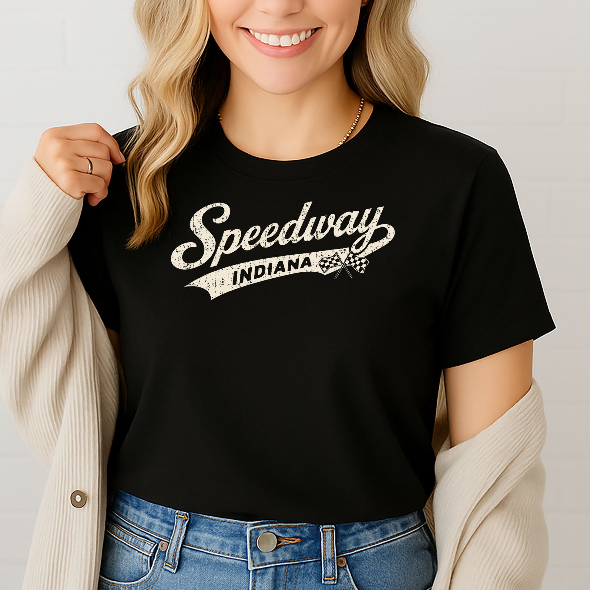 Female model wearing Indy racing t-shirt against white brick background